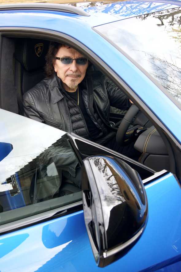 Tony Iommi, guitarist  of  Black Sabbath in his blue Lamborghini Urus